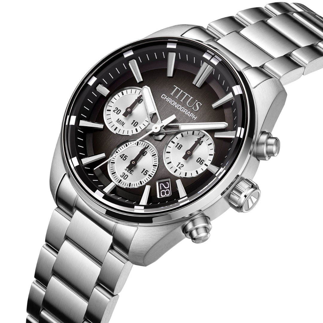 Solvil et Titus Saber Chronograph W06-03414-001 — angled view showing charcoal sunburst dial, silver subdials with concentric texture, crown engraved with the saber-toothed tiger's tooth symbol, date display at 4 o'clock